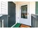 Close-up of the front entrance featuring a welcome mat at 850 Fairway Dr. # 1003Ee, Longs, SC 29568
