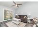The living room boasts a ceiling fan, sliding glass doors to the outdoor space and comfortable seating at 850 Fairway Dr. # 1003Ee, Longs, SC 29568