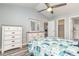 A well-lit main bedroom features coastal-themed bedding, vaulted ceiling, and ample closet space at 850 Fairway Dr. # 1003Ee, Longs, SC 29568