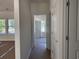 Hallway offers natural light from windows at the end of the hall at 8545 Pee Dee Hwy., Conway, SC 29527