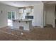 Modern kitchen with white cabinets, a stylish backsplash, stainless steel sink, and plenty of natural light at 8545 Pee Dee Hwy., Conway, SC 29527