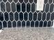 Close-up of the kitchen backsplash offering a stylish and contemporary design that enhances the kitchen's ambiance at 8545 Pee Dee Hwy., Conway, SC 29527