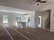 A large living space featuring an open floor plan that includes a kitchen and staircase to the second level at 8545 Pee Dee Hwy., Conway, SC 29527
