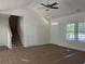 Inviting living space featuring a staircase, ample windows, and a neutral color palette to personalize your own style at 8545 Pee Dee Hwy., Conway, SC 29527