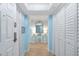 Inviting hallway with a decorative mirror and a view to an ocean-inspired decorated space at 8560 Queensway Blvd. # 2002, Myrtle Beach, SC 29572