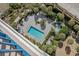 Bird's eye view of a private pool and jacuzzi surrounded by lush landscaping at 8560 Queensway Blvd. # 2002, Myrtle Beach, SC 29572