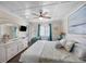 Charming bedroom featuring a coastal design, complemented by white furniture and an ocean view at 900 N Waccamaw Dr. # 203, Garden City Beach, SC 29576