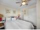 Comfortable bedroom featuring coastal decor and a white ceiling fan at 900 N Waccamaw Dr. # 203, Garden City Beach, SC 29576