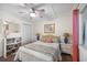Serene bedroom with a queen bed, built-in shelving, and cozy decor at 900 N Waccamaw Dr. # 203, Garden City Beach, SC 29576