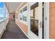 Exterior view of condo featuring peach paint and ocean view at 900 N Waccamaw Dr. # 203, Garden City Beach, SC 29576