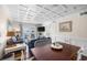 Living room dining area combination with balcony access and beach-themed decor at 900 N Waccamaw Dr. # 203, Garden City Beach, SC 29576