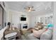 Cozy sunroom with tile floors, comfortable seating, and decorative coastal accents at 900 N Waccamaw Dr. # 203, Garden City Beach, SC 29576