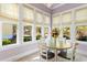 Cozy dining area featuring a dining table, chairs, and sun-filled windows at 9100 Sw Fountain St., Calabash, NC 28467