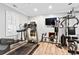 Well-equipped home gym with modern exercise equipment and natural light at 9100 Sw Fountain St., Calabash, NC 28467