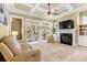 Spacious living room with coffered ceiling, fireplace, and sliding doors to a patio at 9100 Sw Fountain St., Calabash, NC 28467