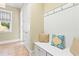 Inviting mud room with built-in bench, hooks, and decorative pillows at 9100 Sw Fountain St., Calabash, NC 28467