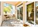 Comfortable screened porch featuring outdoor furniture and a view of the surrounding greenery at 9100 Sw Fountain St., Calabash, NC 28467