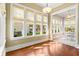 Sunlit bonus room showcasing large windows offering plenty of natural light and backyard views at 9100 Sw Fountain St., Calabash, NC 28467