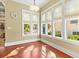 Bright sun room featuring large windows with natural light and hardwood flooring at 9100 Sw Fountain St., Calabash, NC 28467