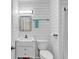Modern bathroom with shiplap walls, vanity, and a red storage bin under the sink at 9501 Shore Dr. # D-132, Myrtle Beach, SC 29572