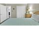 Serene bedroom offering a closet, light wood furnishings, and access to hallway at 9501 Shore Dr. # D-132, Myrtle Beach, SC 29572