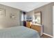 Bedroom with neutral walls, a large window, and matching bedside tables at 9501 Shore Dr. # D-132, Myrtle Beach, SC 29572