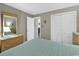Bright bedroom with a large mirror, closet, and access to the hallway at 9501 Shore Dr. # D-132, Myrtle Beach, SC 29572