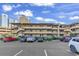 A multi-story condo complex with car parking at 9501 Shore Dr. # D-132, Myrtle Beach, SC 29572