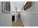 Hallway leading to a living space, featuring wood floors and beach-themed decor at 9501 Shore Dr. # D-132, Myrtle Beach, SC 29572