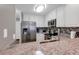 Functional kitchen showcasing white cabinetry, stainless steel appliances, and granite countertops at 9501 Shore Dr. # D-132, Myrtle Beach, SC 29572