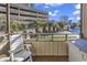 Cozy patio with a view of trees and a parking garage at 9501 Shore Dr. # D-132, Myrtle Beach, SC 29572