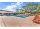 A pool with a brick deck and lounge chairs at 9501 Shore Dr. # D-132, Myrtle Beach, SC 29572