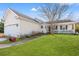 Inviting single-story home with an attached garage, a cozy front porch, and well-maintained lawn at 9554 Sullivan Dr., Murrells Inlet, SC 29576