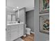 Bathroom featuring a white vanity, tile floors, and framed art on the light gray walls at 9650 Shore Dr. # 604, Myrtle Beach, SC 29572