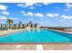 Enjoy the outdoor pool with ample lounge seating, ocean views, and sunny skies at 9650 Shore Dr. # 604, Myrtle Beach, SC 29572