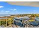 Balcony with seating area and stunning ocean views at 101 Ocean Creek Dr. # Mm-5, Myrtle Beach, SC 29572