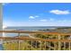 Balcony with views of the beach, lush greenery, and picturesque scenery at 101 Ocean Creek Dr. # Mm-5, Myrtle Beach, SC 29572