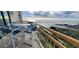 Inviting balcony with comfortable seating and beautiful ocean views at 101 Ocean Creek Dr. # Mm-5, Myrtle Beach, SC 29572