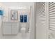 Bathroom with a granite-topped vanity, modern mirror, and a shower/tub combo at 101 Ocean Creek Dr. # Mm-5, Myrtle Beach, SC 29572