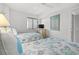 Bedroom featuring two twin beds with nautical-themed bedding and a view of the outside at 101 Ocean Creek Dr. # Mm-5, Myrtle Beach, SC 29572