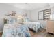 Cozy bedroom features two twin beds with nautical-themed bedding and bright natural light at 101 Ocean Creek Dr. # Mm-5, Myrtle Beach, SC 29572