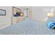 Cozy bedroom showcasing a dresser with a mirror, a television, and a comfortable queen bed at 101 Ocean Creek Dr. # Mm-5, Myrtle Beach, SC 29572