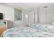 Bedroom featuring two twin beds with nautical-themed bedding, a TV, and closet at 101 Ocean Creek Dr. # Mm-5, Myrtle Beach, SC 29572