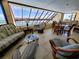 Inviting living room with ample seating, a coffee table, and a large window with ocean views at 101 Ocean Creek Dr. # Mm-5, Myrtle Beach, SC 29572