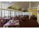 Restaurant interior with vaulted ceilings, large windows, and well-spaced tables with elegant place settings at 101 Ocean Creek Dr. # Mm-5, Myrtle Beach, SC 29572