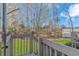 A backyard view from a wooden deck overlooking trees and green grass at 110 Horizon River Dr. # I-2, Myrtle Beach, SC 29588