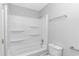 This bathroom features a shower and tub combination, with built-in shelving at 110 Horizon River Dr. # I-2, Myrtle Beach, SC 29588
