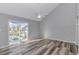 Bright bedroom with wood-look floors, ceiling fan, and sliding glass doors opening to a balcony at 110 Horizon River Dr. # I-2, Myrtle Beach, SC 29588