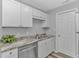 Updated kitchen with stainless steel dishwasher, granite counters, modern cabinetry and fixtures at 110 Horizon River Dr. # I-2, Myrtle Beach, SC 29588