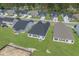 An aerial view of neighborhood backyards, highlighting the well-maintained lawns and community layout at 1204 Nw Calabash Station Blvd., Calabash, NC 28467